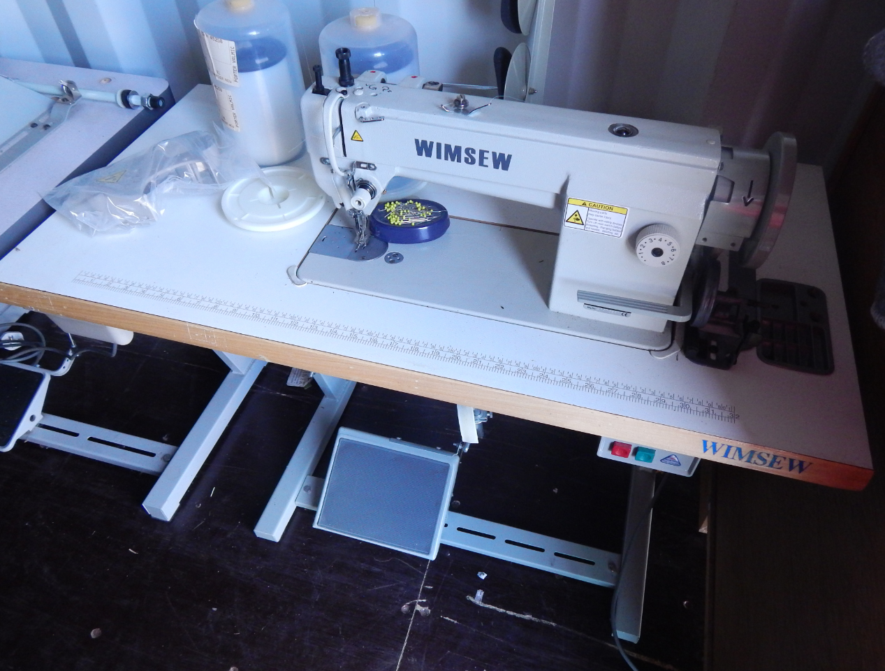 Appraisal: A Wimsew W- electric sewing machine treadle table and attachments