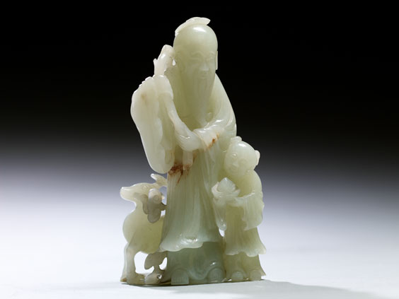 Appraisal: QIANLONG CELADON JADE GROUP Finely detailed antique Chinese carved celadon