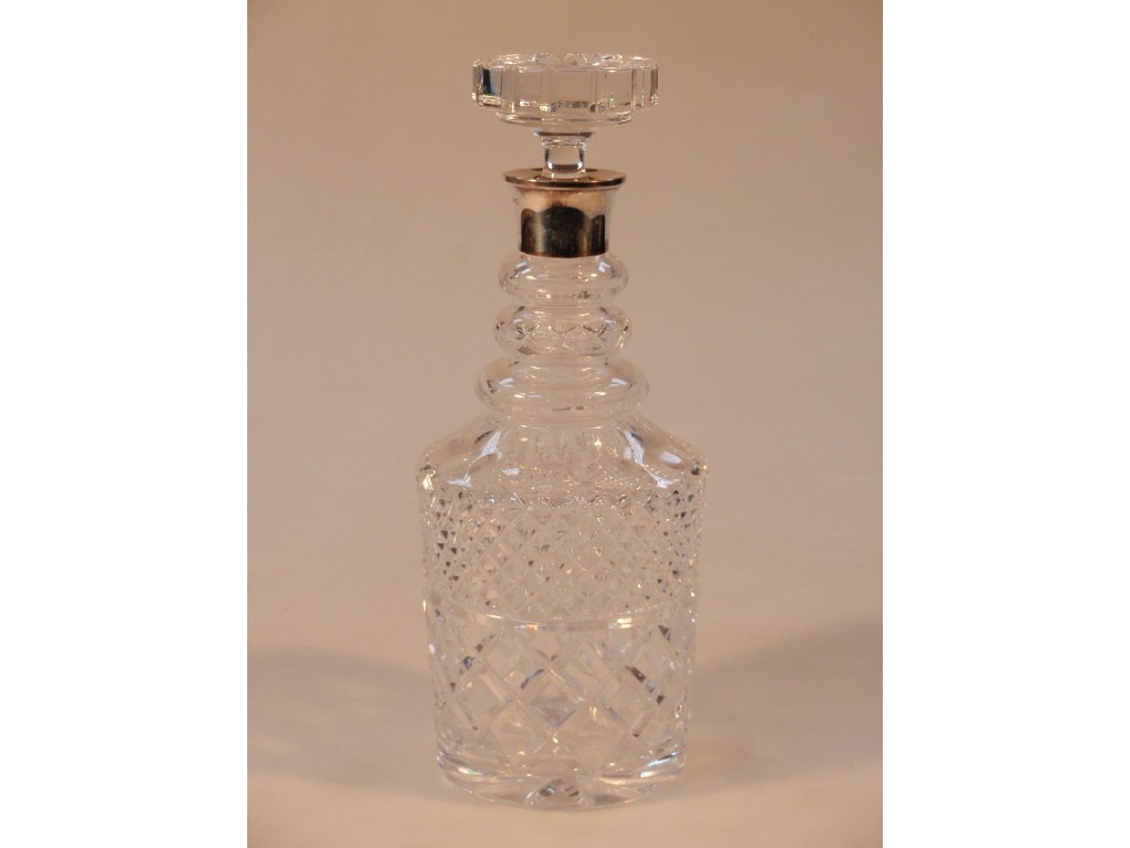 Appraisal: A cut glass decanter with a silver collar modern cm