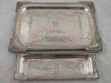 Appraisal: A pair of silver dressing table trays Birmingham Approx x