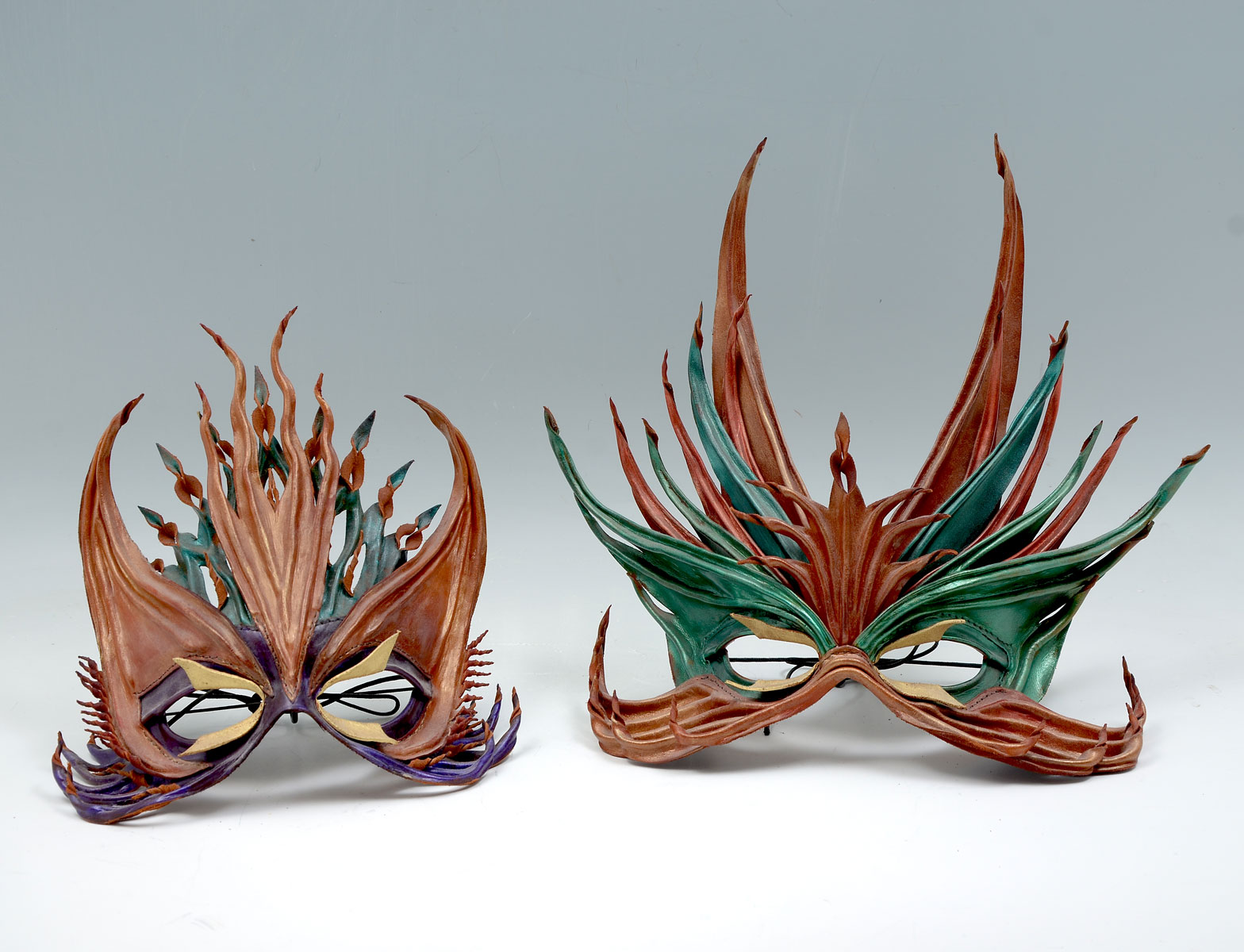 Appraisal: TWO MASKS BY JOHN FLEMMING MALE AND FEMALE Hand designed