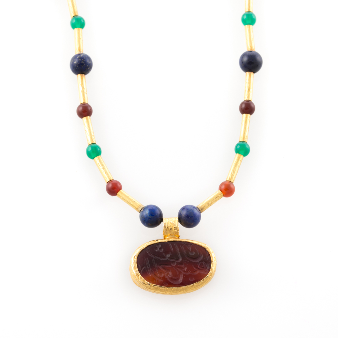 Appraisal: A K Necklace with Beads and Hand Carved Intaglio K