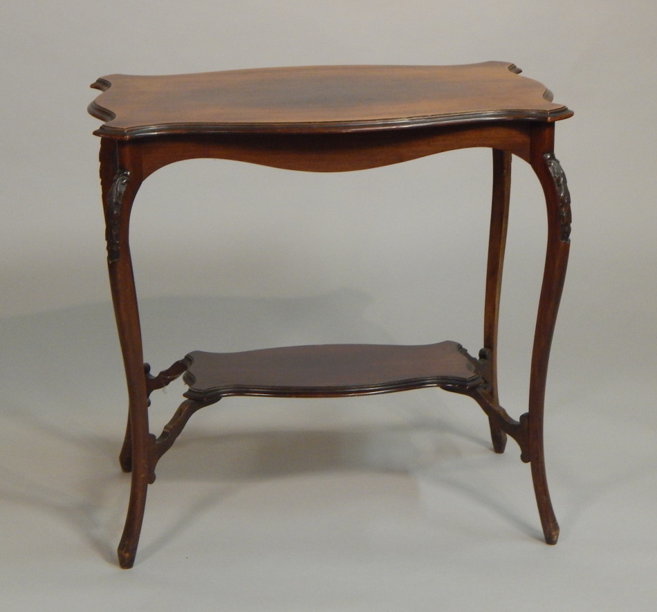 Appraisal: An Edwardian mahogany two tier table the rectangular top with