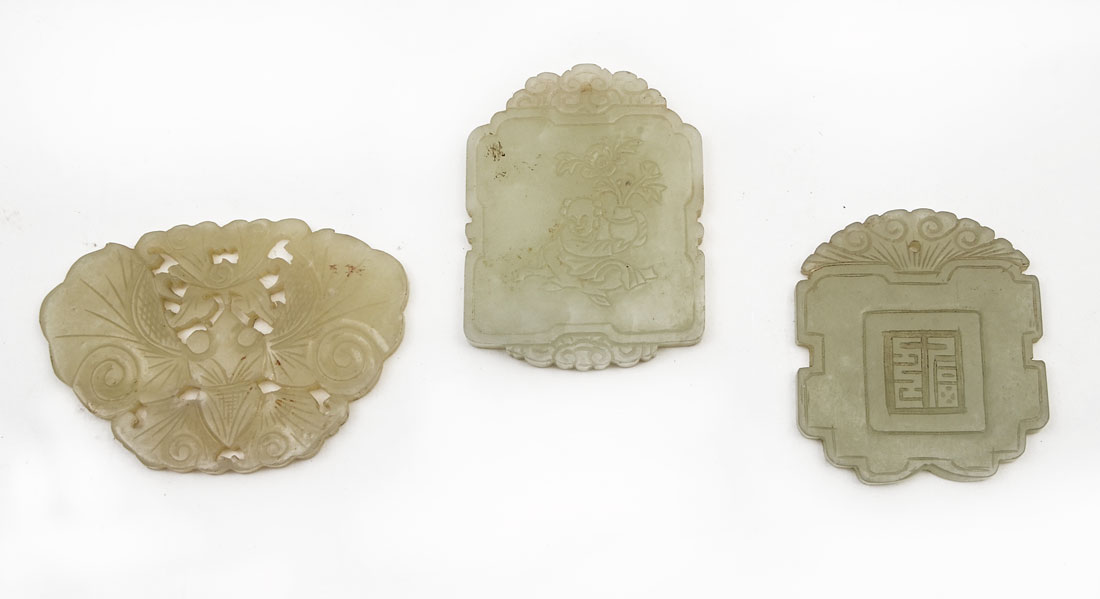 Appraisal: CHINESE CARVED JADE PENDANTS pieces carved jade or similar stone