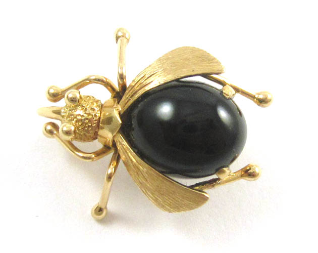 Appraisal: BLACK JADE AND YELLOW GOLD BEETLE BROOCH The k gold