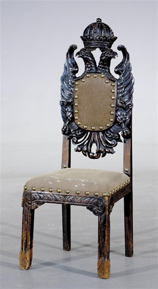 Appraisal: Continental carved pine hall chair th th century crown resting