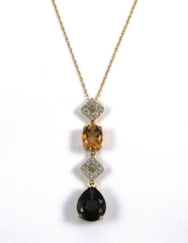 Appraisal: SMOKY QUARTZ AND CITRINE PENDANT NECKLACE the pendant set with