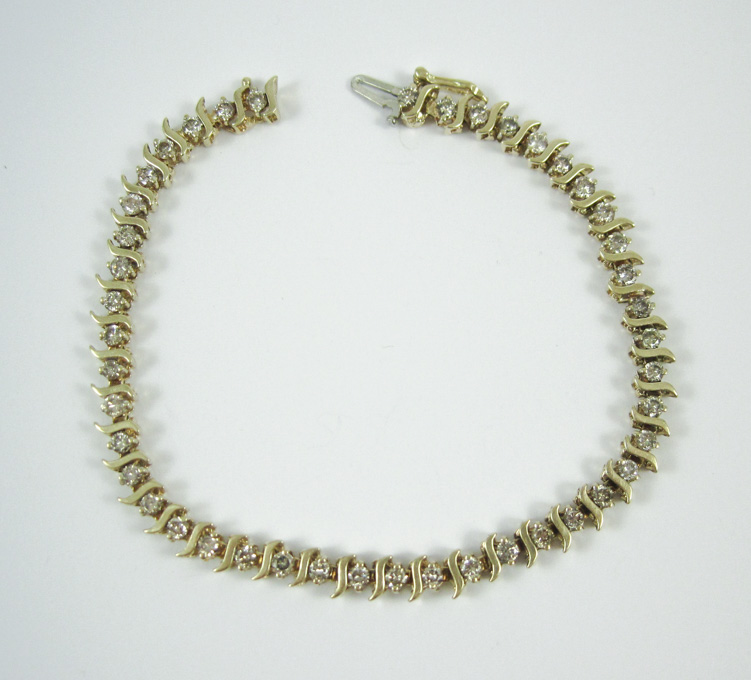 Appraisal: DIAMOND AND TEN KARAT GOLD BRACELET measuring - inches in