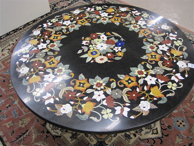 Appraisal: ROUND PIETRE DURE TABLE TOP inlaid in a colorful floral