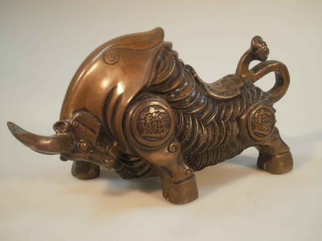 Appraisal: A Chinese cast bronze stylized figure of a bull