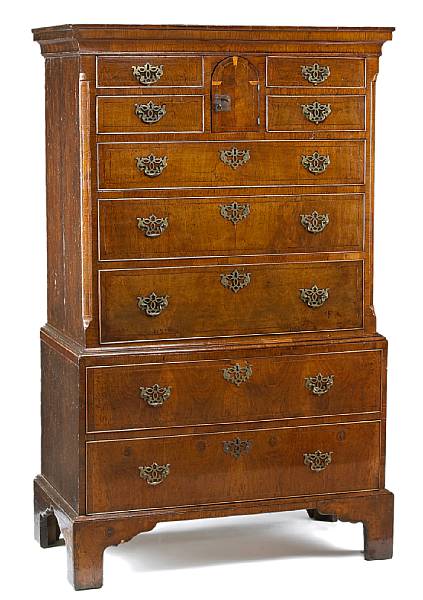 Appraisal: A George II crossbanded and inlaid walnut chest of drawers