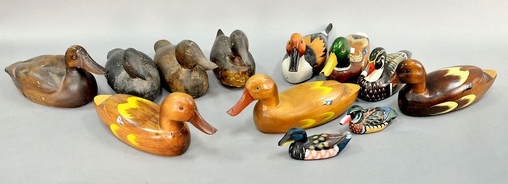 Appraisal: Twelve carved wood duck decoys including nine newer decoys and