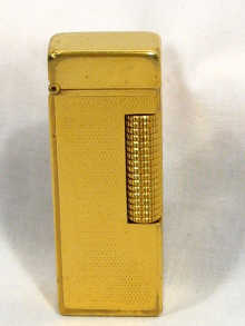 Appraisal: Dunhill A Dunhill gold plated gas lighter