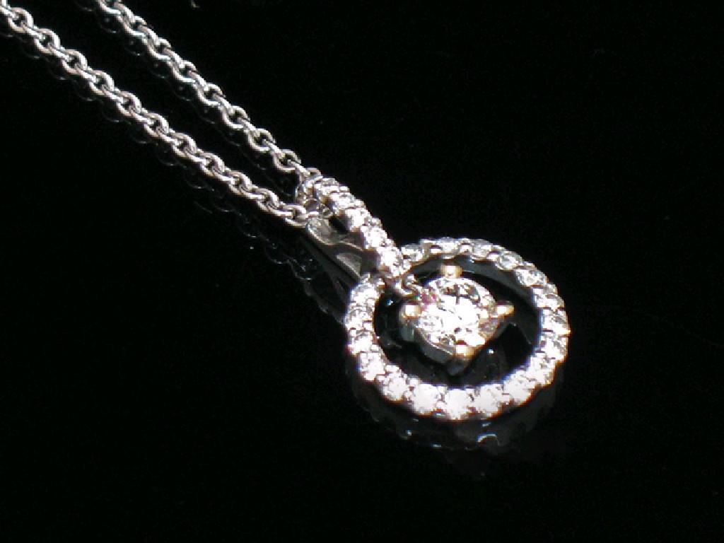 Appraisal: A DIAMOND PENDANT the round brilliant-cut claw-set diamond c cts