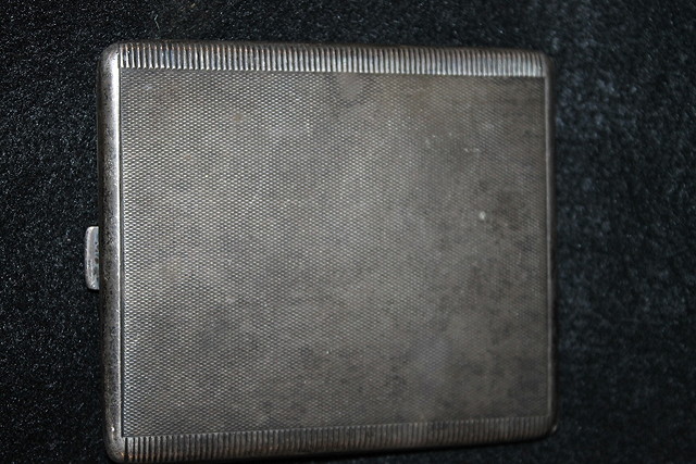 Appraisal: A SILVER CIGARETTE CASE with gilt interior and engine turned