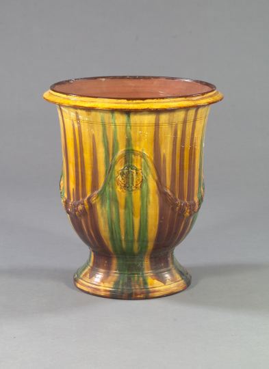 Appraisal: French Provincial Ochre and Green-Glazed Majolica Footed Urn the everted