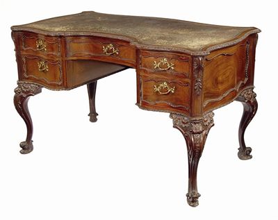 Appraisal: A carved mahogany writing table in George II style the