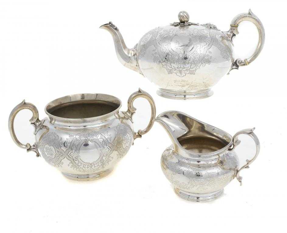 Appraisal: A VICTORIAN TEAPOT AND SUGAR BOWL of globular form engraved