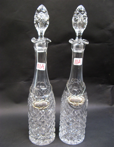 Appraisal: PAIR OF CUT CRYSTAL TALL DECANTERS having Sterling Silver tags