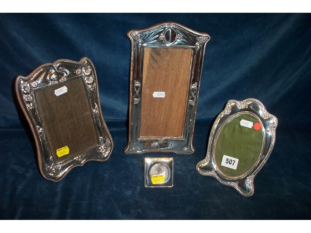 Appraisal: Three silver photograph frames of various styles with embossed decoration