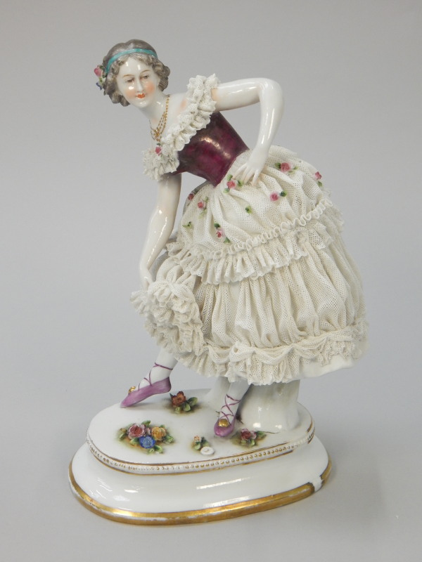 Appraisal: A Dresden type crinoline lady modelled in the form of