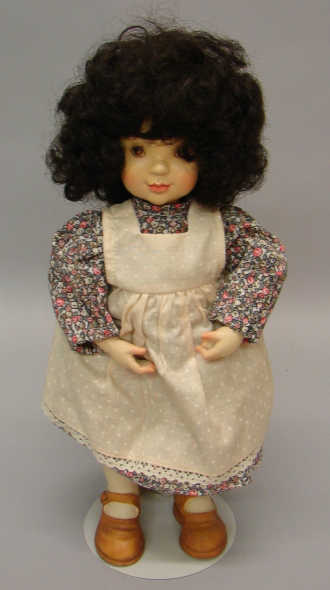 Appraisal: All wood ANRI female doll designed by Sarah Kay Dark