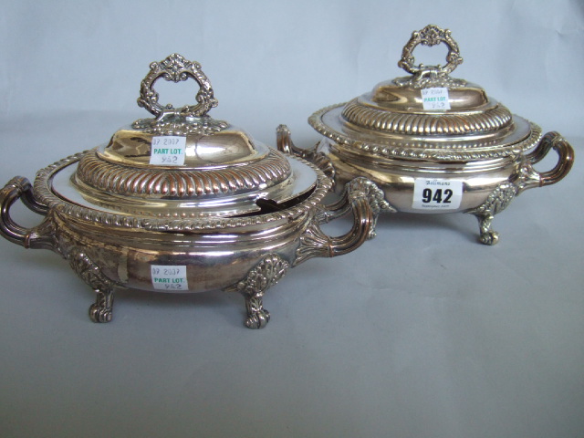 Appraisal: A pair of Old Sheffield plated oval twin handled lidded