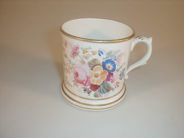 Appraisal: A Victorian porcelain mug painted with flower sprays and inscribed