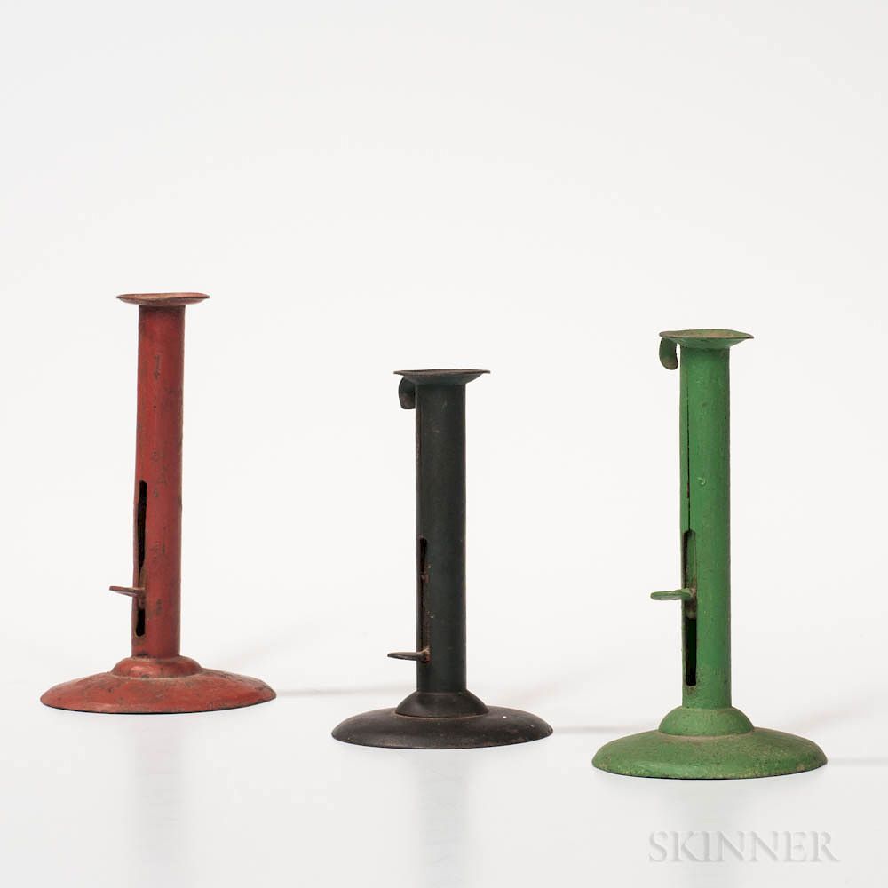 Appraisal: Three Painted Iron Hogscraper Candlesticks Three Painted Iron Hogscraper Candlesticks