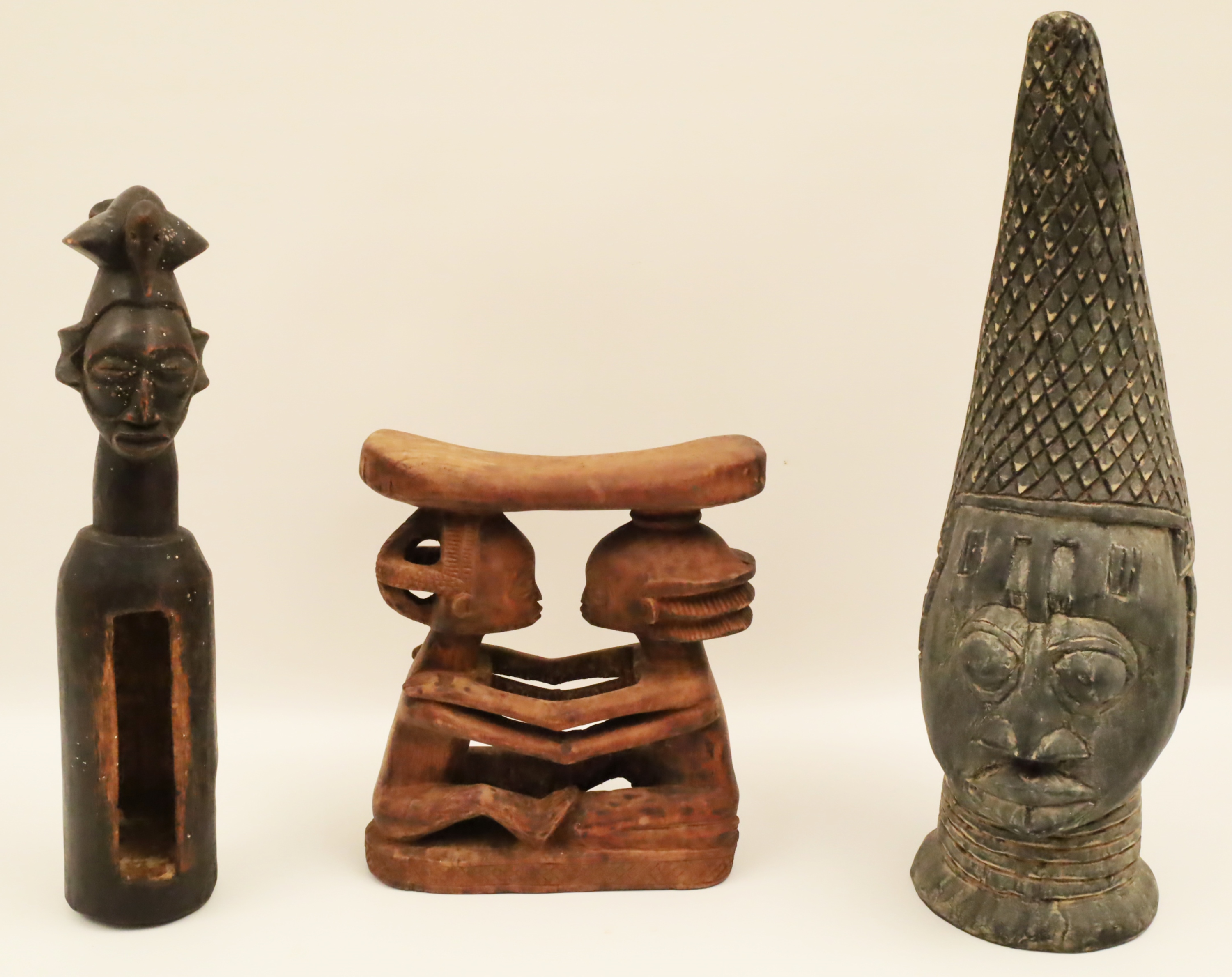 Appraisal: THREE AFRICAN CARVED WOOD TOTEMS Including a cylindrical charm container