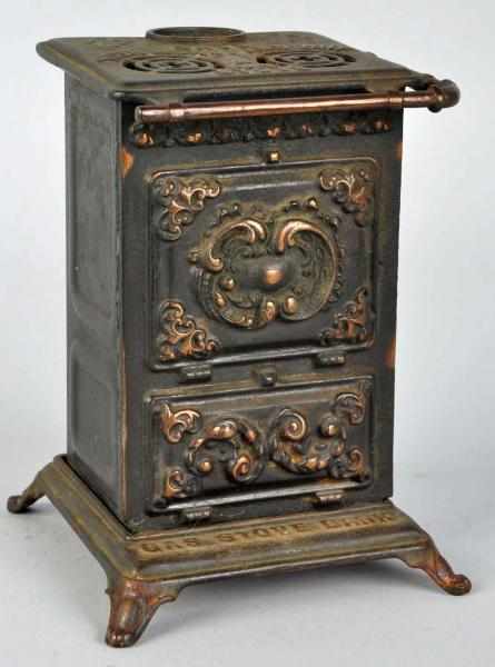 Appraisal: Cast Iron Tin Gas Stove Still Bank Condition Very Good