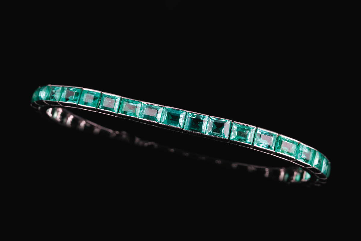 Appraisal: EMERALD STRAIGHT LINE BRACELET The platinum bracelet set with forty