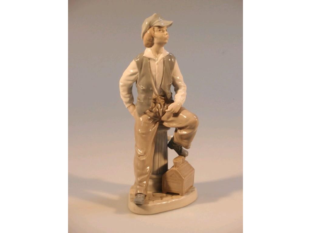 Appraisal: A Nao figure of a 'shoe shine boy' seated on