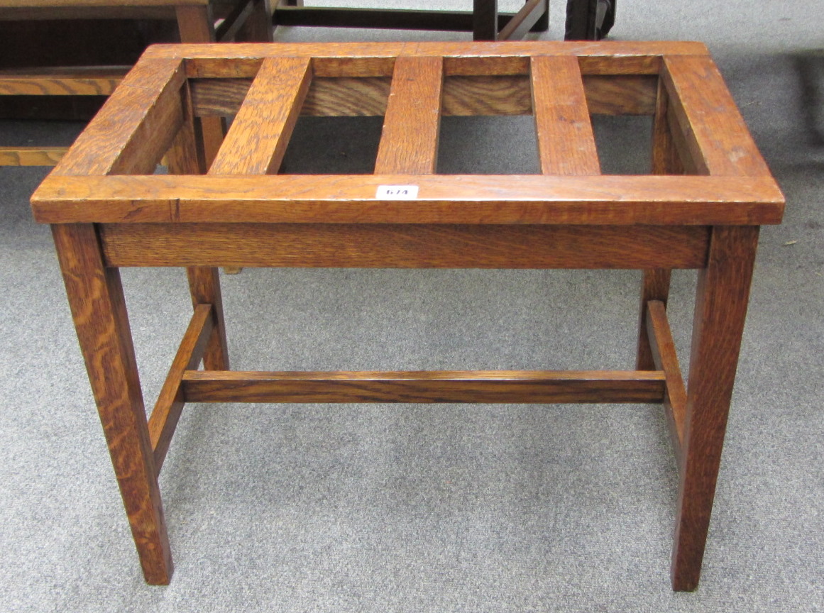 Appraisal: A th century oak framed luggage stand of slatted construction