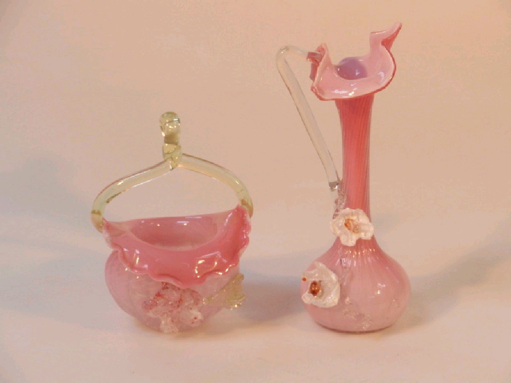 Appraisal: A pink cased glass ewer of bellied form with an