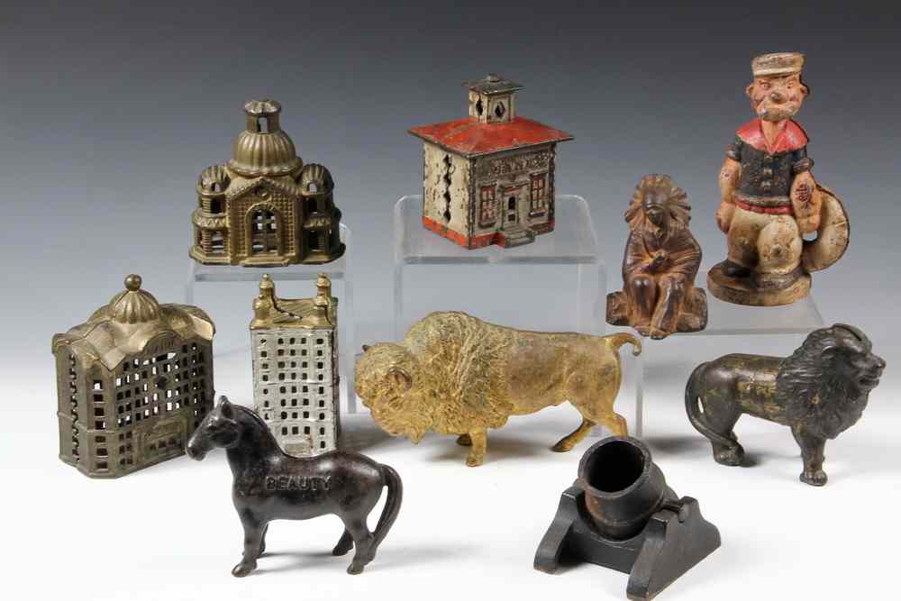 Appraisal: CAST-IRON BANKS FIGURES - Including Still Bank in Gold Paint