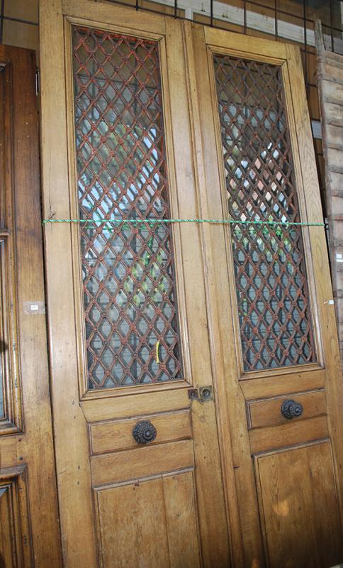 Appraisal: A PAIR OF FRENCH OAK AND WROUGHT IRON DOORS each