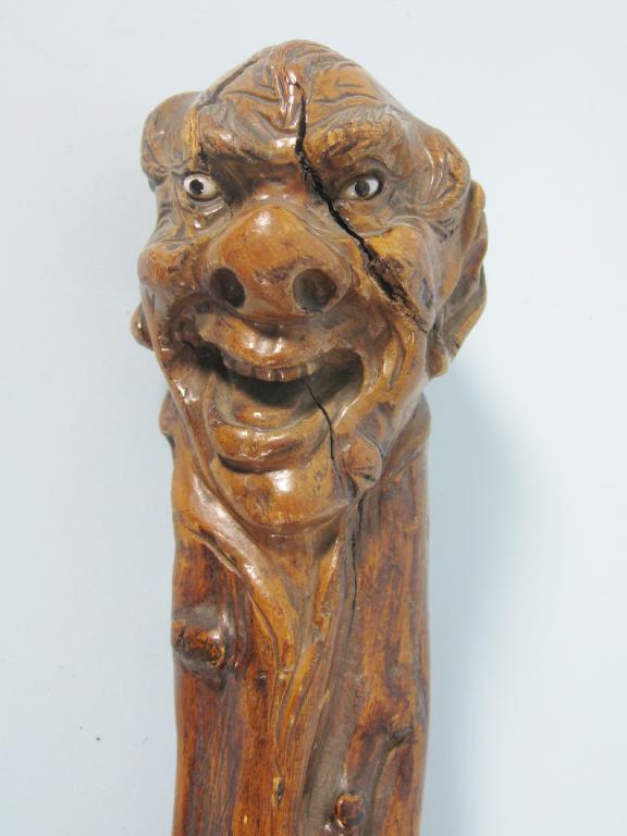 Appraisal: A heavy Walking Stick the handle carved with character face