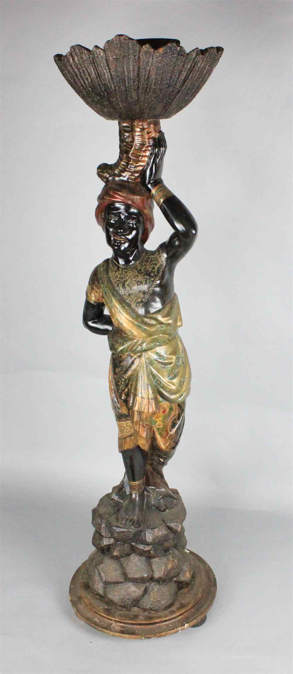 Appraisal: CONTINENTAL POLYCHROME PAINTED FIGURE OF A BLACKAMOOR the turbanned figure