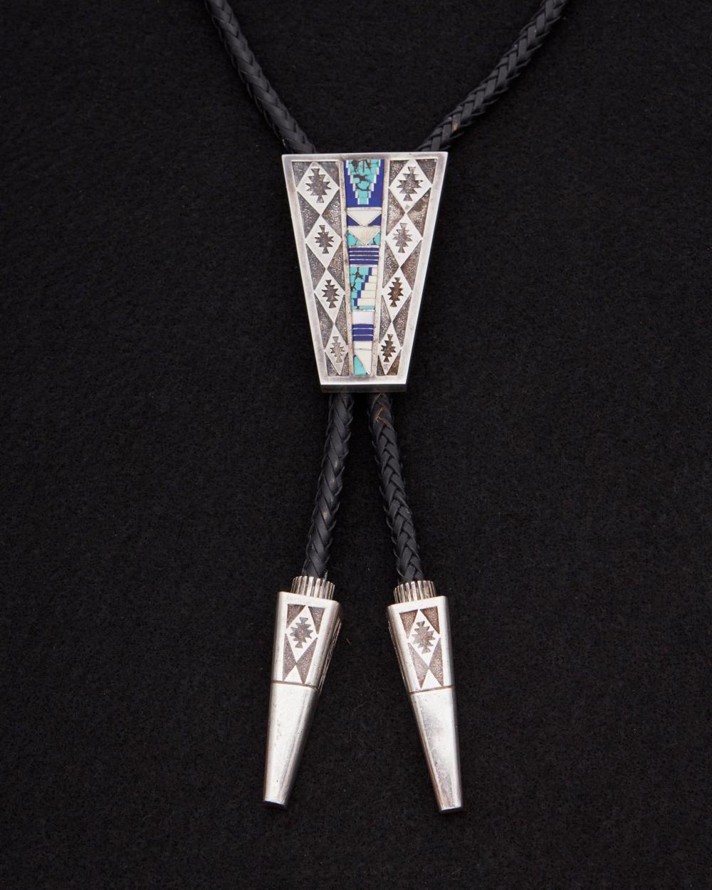 Appraisal: An Abraham Begay inlaid sandcast sterling bolo tie Mid- th