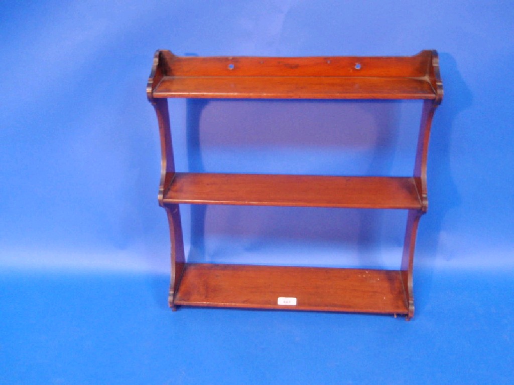 Appraisal: A Victorian mahogany three shelf wall mounted book rack cm