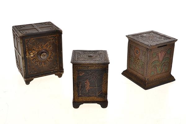 Appraisal: THREE CAST IRON SAFE STILL BANKS American c late th