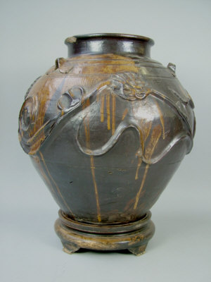 Appraisal: A Chinese pottery vase of ovoid form with applied flower