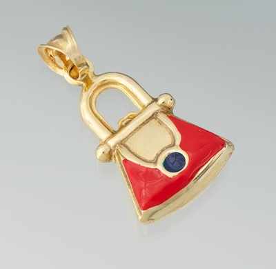 Appraisal: A Gold and Enamel Purse Charm k yellow gold charm