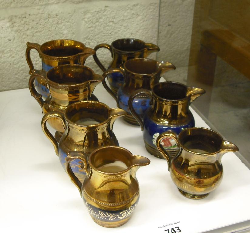 Appraisal: Eight various size copper lustre milk and cream jugs