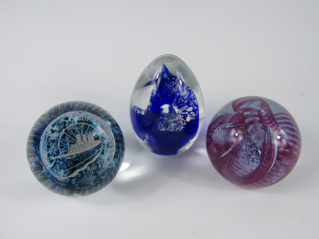 Appraisal: Caithness glass paperweights comprising Titanic Fiesta and Deja Vu