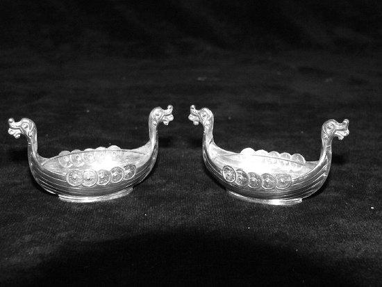 Appraisal: A pair of Norwegian salts of Viking longboat form David