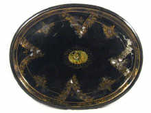 Appraisal: An oval toleware tray decorated with a rural scene circa