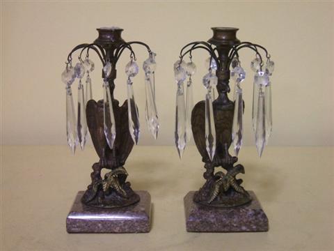 Appraisal: PAIR OF PAINTED EAGLE FORM CANDLESTICKS The eagle standing above