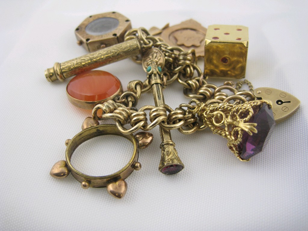 Appraisal: A ct gold fancy link Charm Bracelet with ten assorted